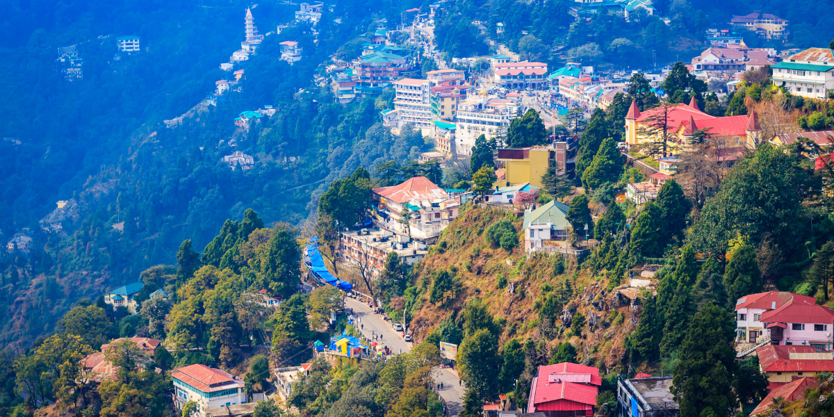 A landscape shot showing houses sat on the side of a steep hill