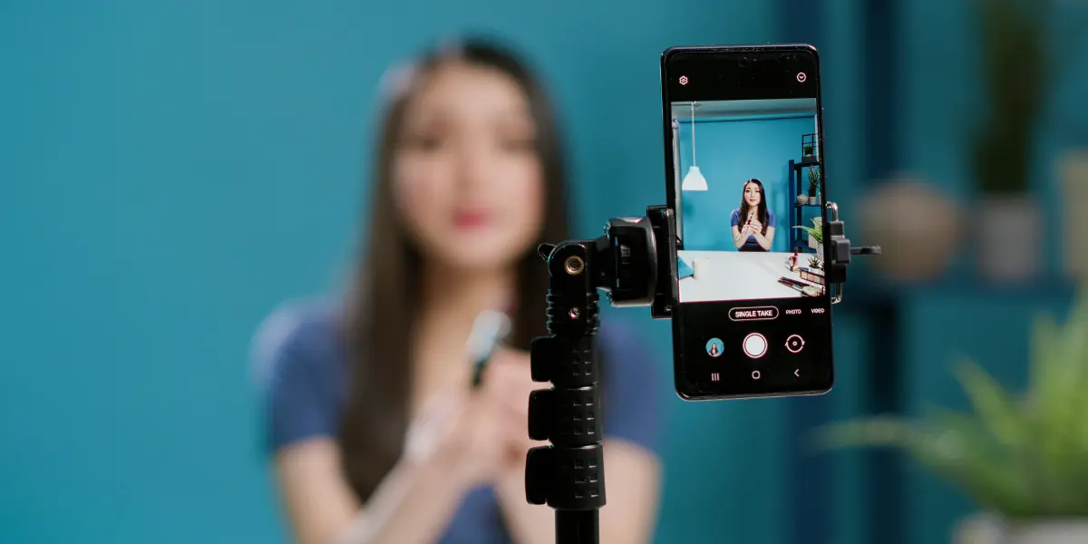 Woman Speaking into a Phone Camera Whilst Recording a Video