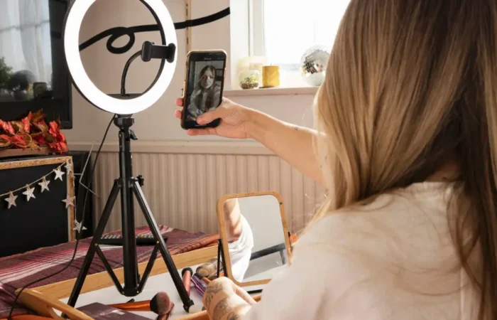 A woman using a ring light